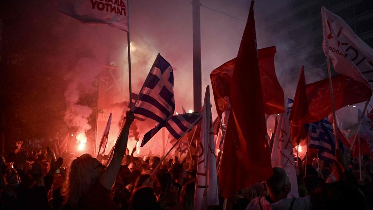 Supporters of Greek opposition leader of Syriza party attend a pre-election speech in Athens on May 18, 2023, ahead of Greece's general elections on May 21. Credit: AFP Photo