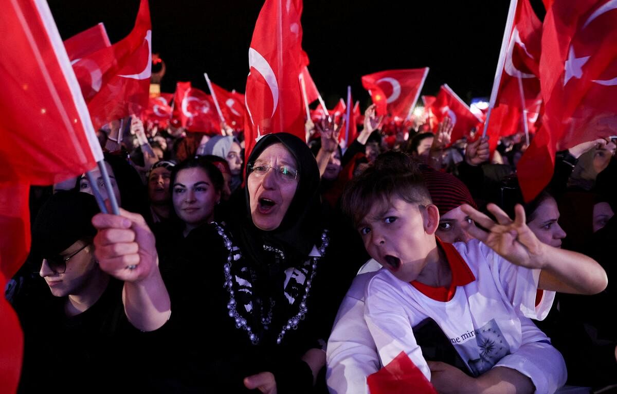Supporters of Turkish President Tayyip Erdogan celebrate following his victory in the second round of the presidential election in Ankara. Credit: Reuters Photo