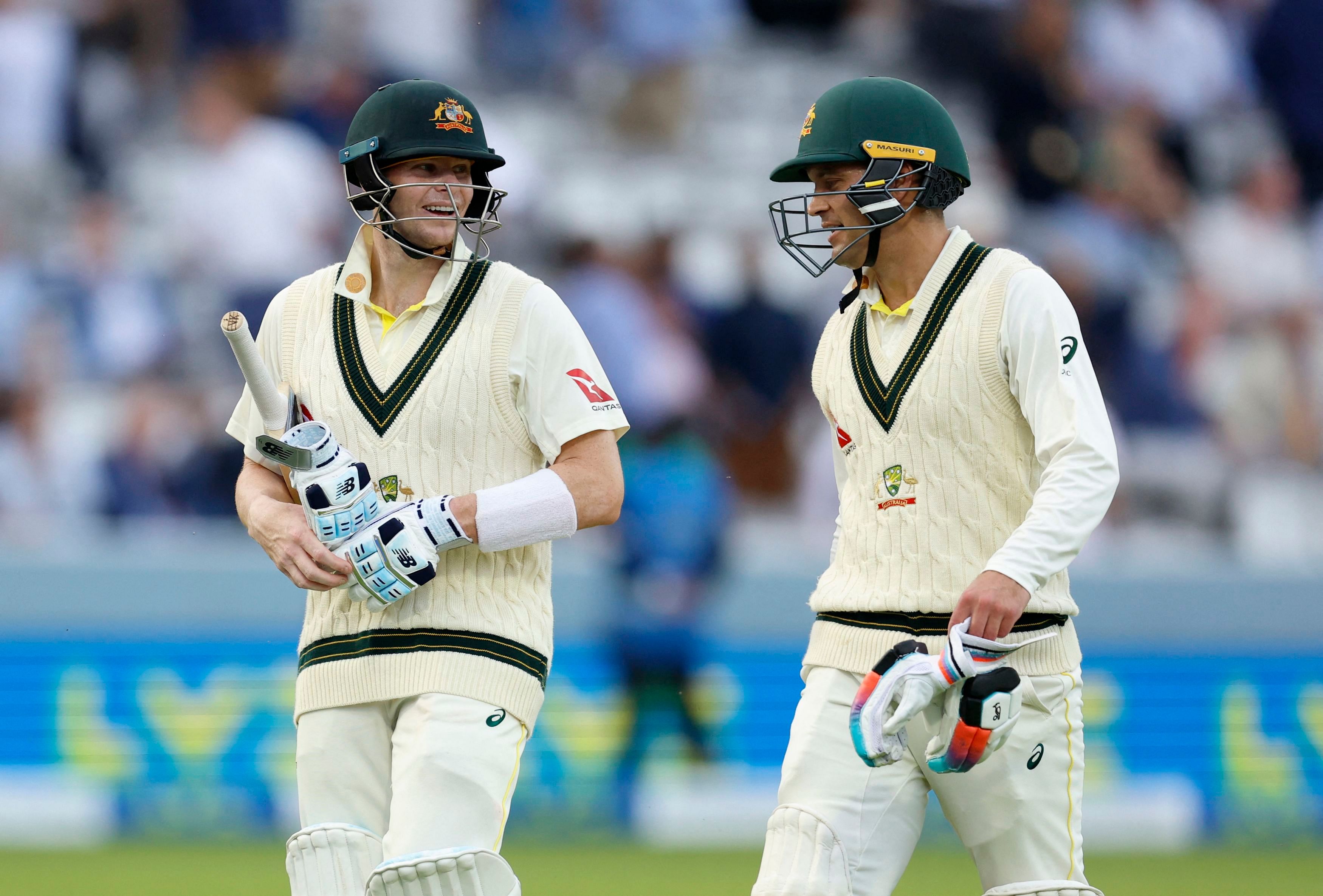 Australia's Steven Smith and Alex Carey walk off the filed at stumps. Credit: Reuters Photo