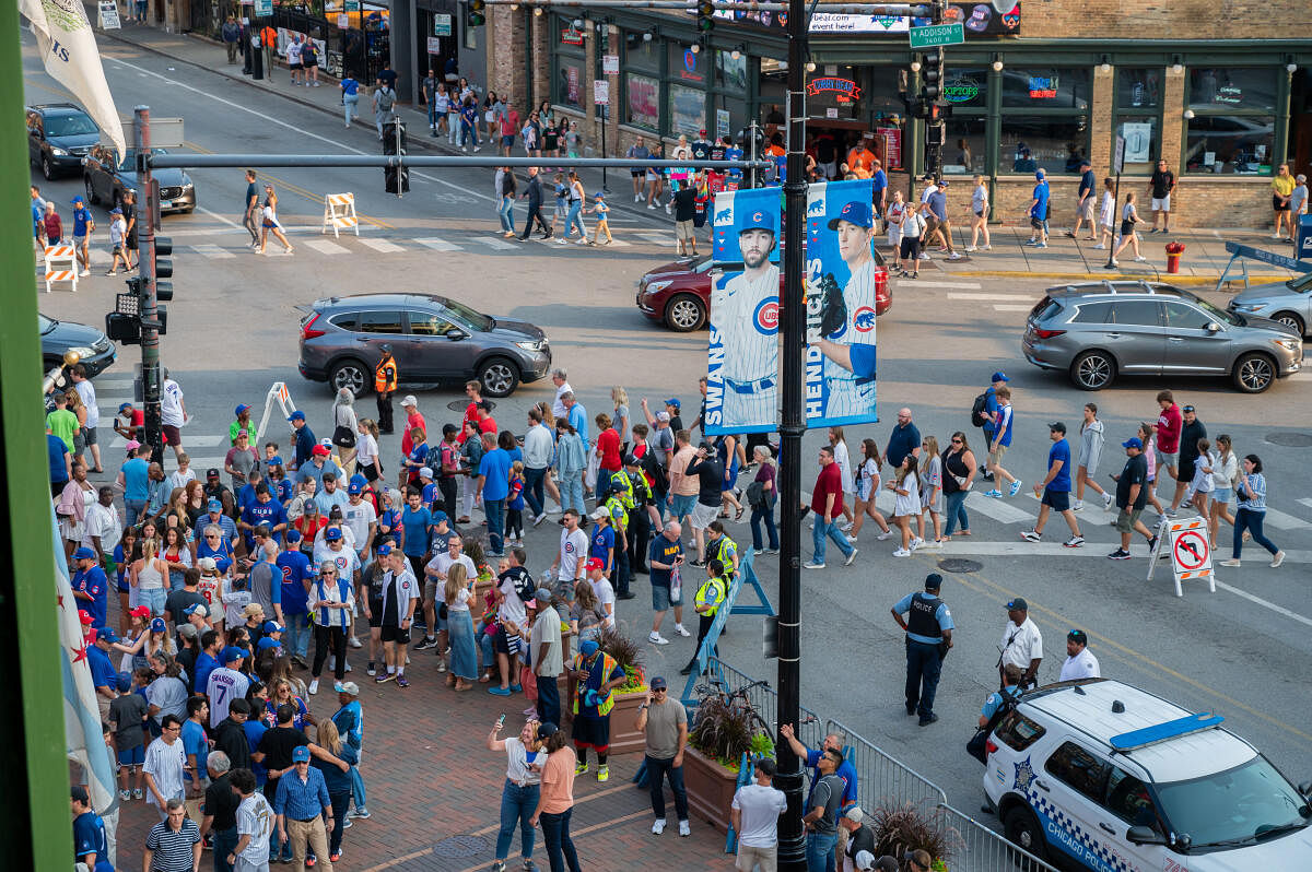 ans enter Wrigley Field prior to a game between the Cincinnati Reds and the Chicago Cubs. Credit: Reuters Photo