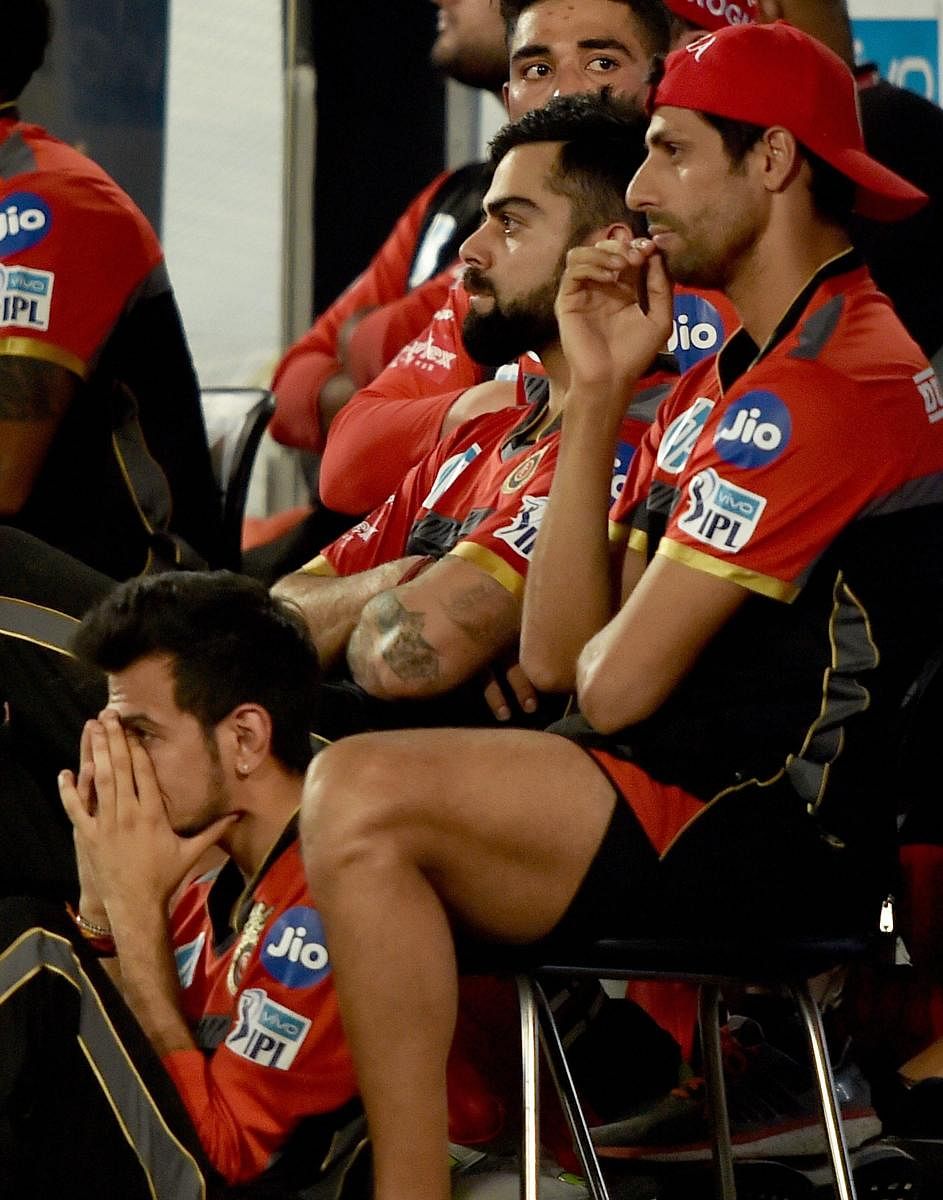 ALL GLOOM The RCB dug-out presents a picture of dejection after their defeat against Sunrisers Hyderabad on Monday. PTI