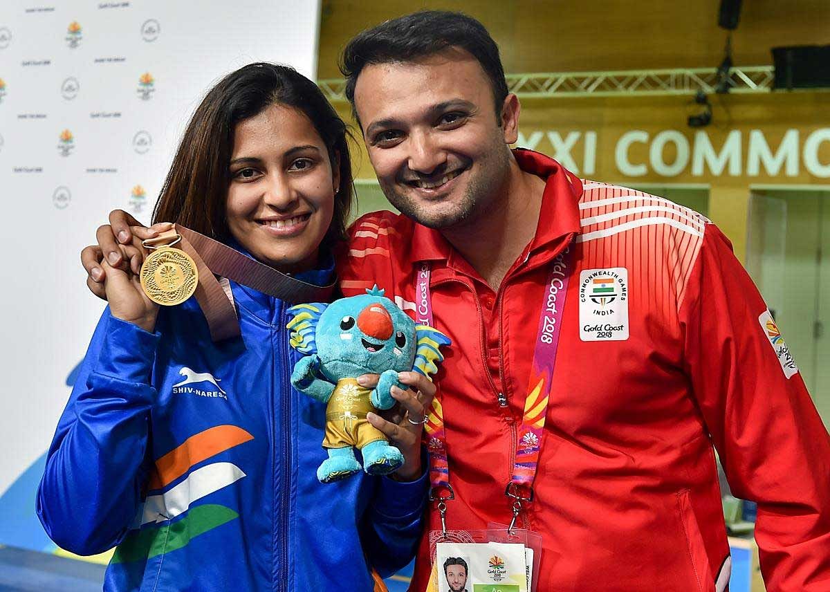 Indian shooter Heena Sidhu with her husband and coach Ronak Pandit after winning a gold medal in the Women’s 25m Pistol final event during the Commonwealth Games 2018, at the Belmont Shooting Centre in Brisbane on Tuesday. PTI Photo